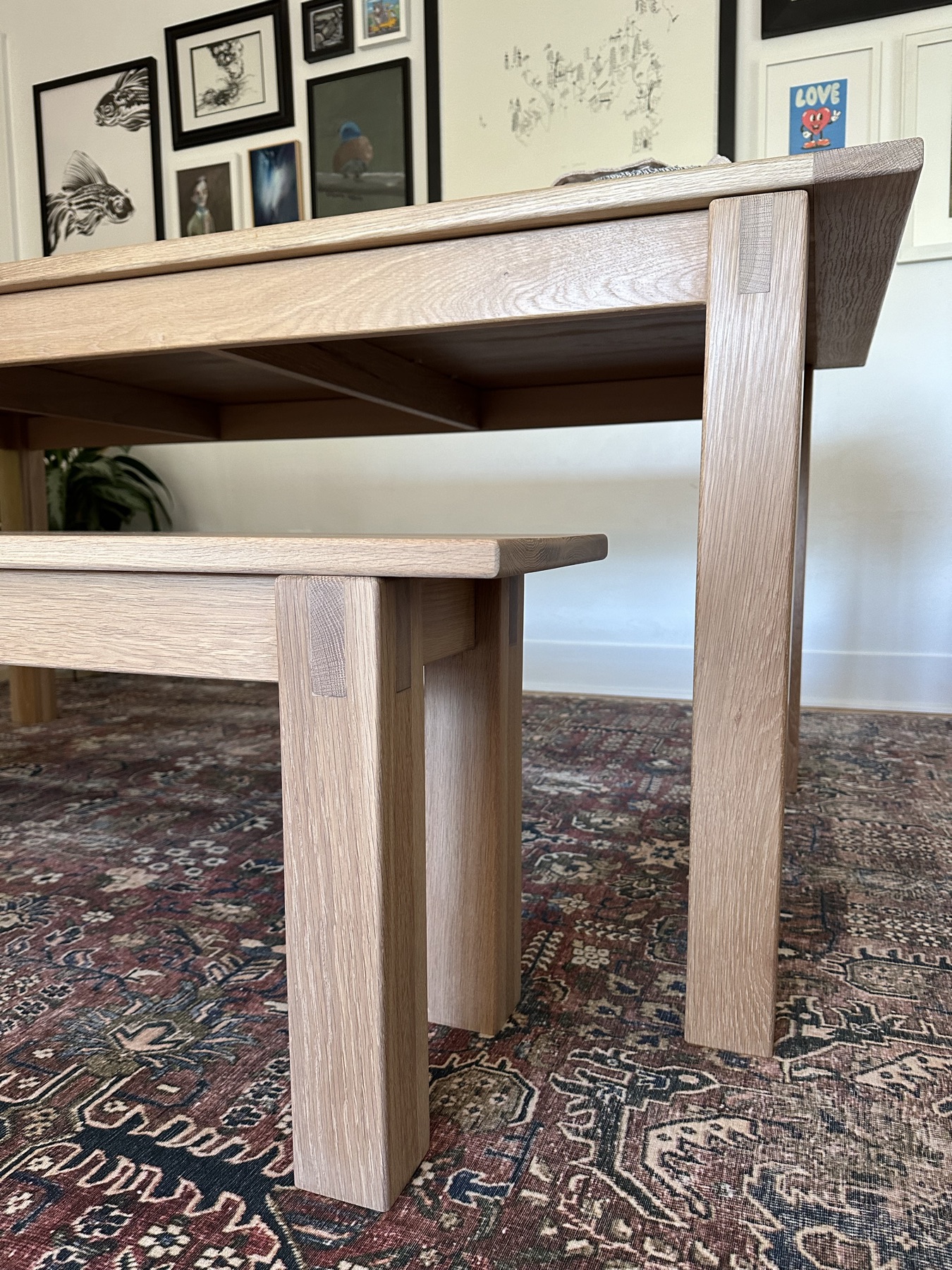 Close-up of the table and bench legs, showing the joinery where each leg meets the frame